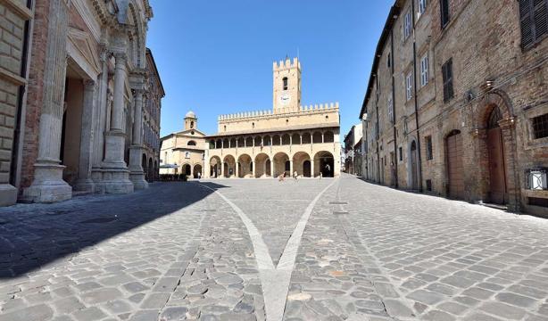Sunny historic square, medieval architecture, silence and serenity.