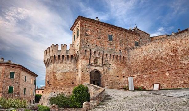 Ancient brick castle, medieval atmosphere, dramatic sky.